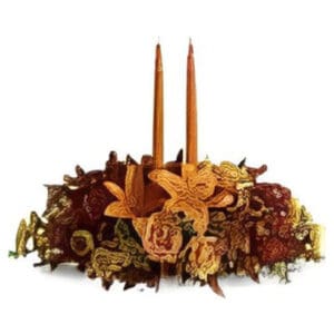 Autumnal centerpiece with two candles.