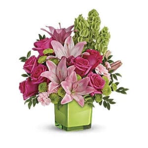 Pink and green flower arrangement in vase.