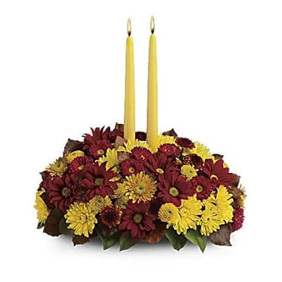 Autumn floral centerpiece with candles.