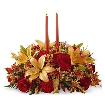 Autumnal centerpiece with two candles.