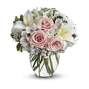 Pink roses and white lilies bouquet.